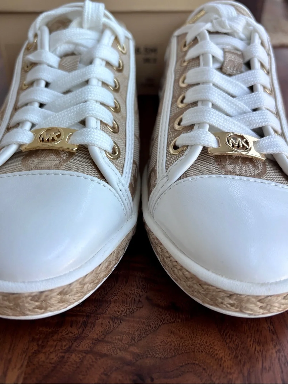 Brand New pair of Michael Kors Kristy Slide Sneakers in a cream and beige, 6.5.